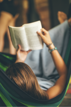 Woman on hammock reading a book