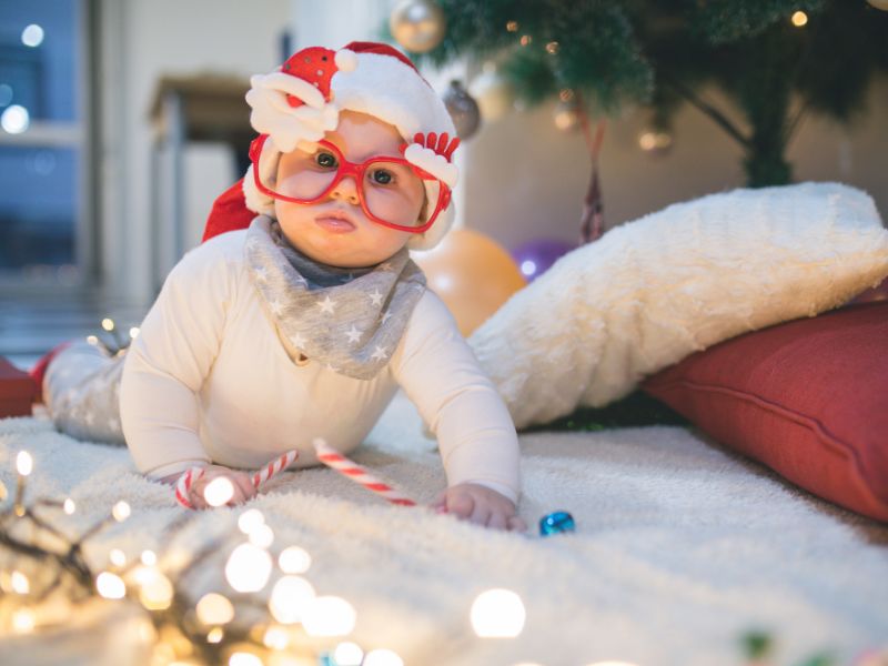 baby wearing christmas glasses